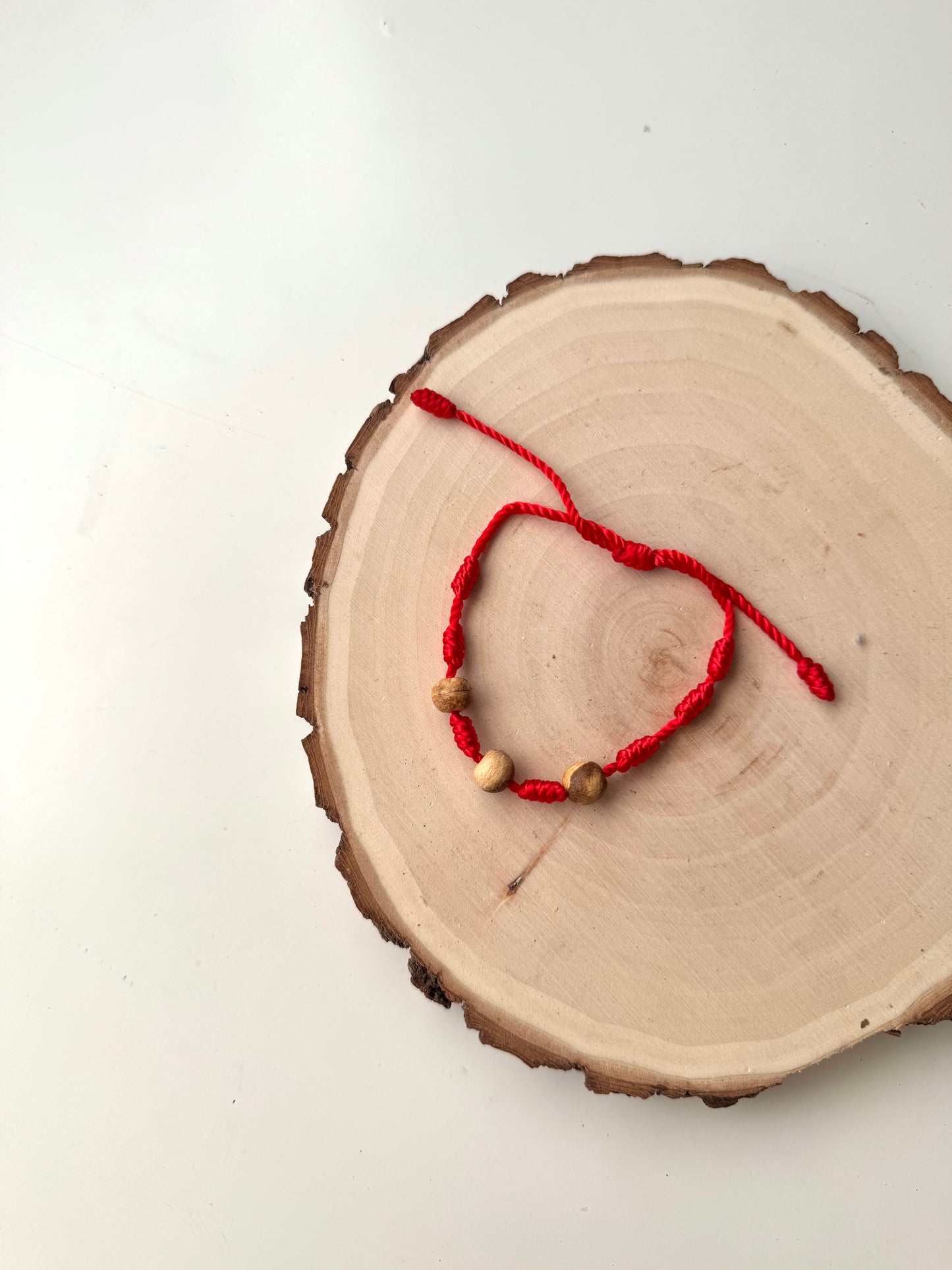 PULSERA 7 NUDOS ROJA PALO SANTO