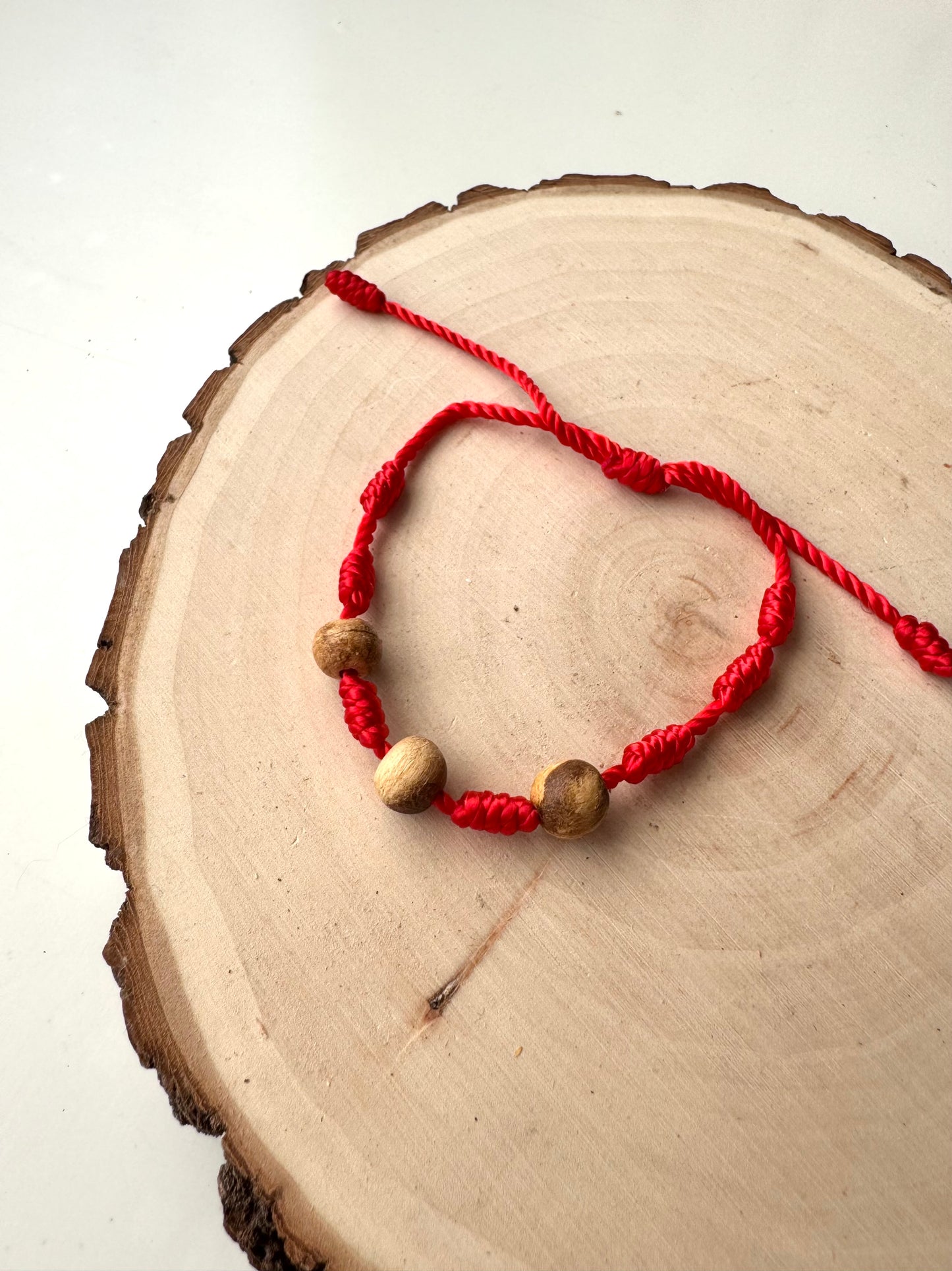 PULSERA 7 NUDOS ROJA PALO SANTO